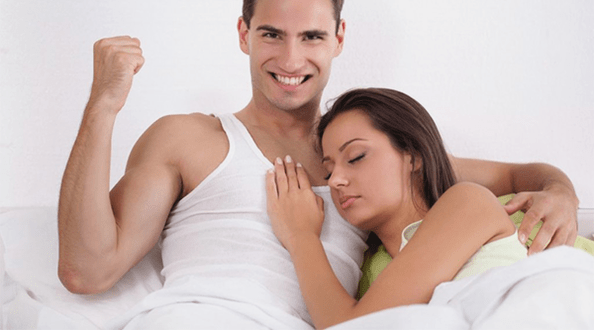 a woman in bed with a man with increased strength